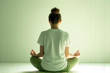 Person meditating peacefully, symbolizing mental clarity and emotional wellness.